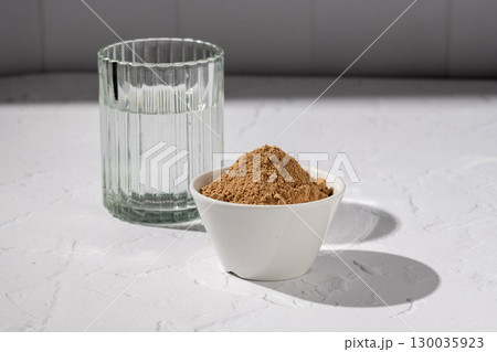 Collagen protein glow powder drink. Glass of collagen beauty drink. Food supplement. 130035923