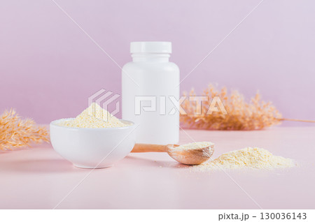 Hydrolyzed collagen protein powder in bowl on table 130036143