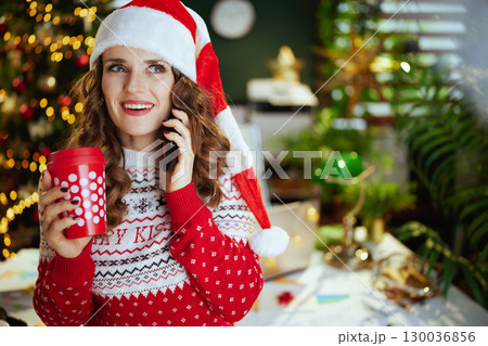 surprised elegant business woman talking on smartphone surprised elegant business woman talking on smartphone 130036856