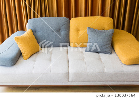 Colorful couch with pillows Colorful couch with pillows 130037564