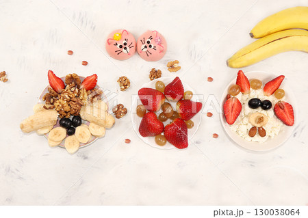 Strawberry yogurt, granola, cottage cheese, fresh berries, apples, strawberries and grapes on a light table. The concept of healthy and natural food. Useful breakfast, food for children, selective Strawberry yogurt, granola, cottage cheese, fresh berries, apples, strawberries and grapes on a light table. The concept of healthy and natural food. Useful breakfast, food for children, selective 130038064