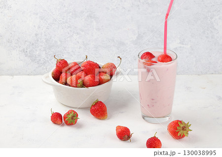Healthy breakfast, food for children, strawberry yogurt, smoothies and granola, strawberries on a light table. The concept of healthy and natural food. selective focus Healthy breakfast, food for children, strawberry yogurt, smoothies and granola, strawberries on a light table. The concept of healthy and natural food. selective focus 130038995