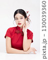 Portrait beauty Asian woman in red Cheongsam Chinese traditional dress isolated on white background. 130039360