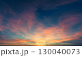 Beautiful gradient orange gold clouds in the morning on a blue sky, perfect for a background. 130040073
