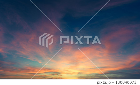 Beautiful gradient orange gold clouds in the morning on a blue sky, perfect for a background. Beautiful gradient orange gold clouds in the morning on a blue sky, perfect for a background. 130040073