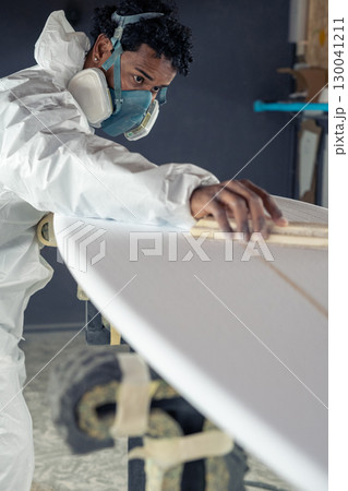 Shaper working on surf board Shaper working on surf board 130041211