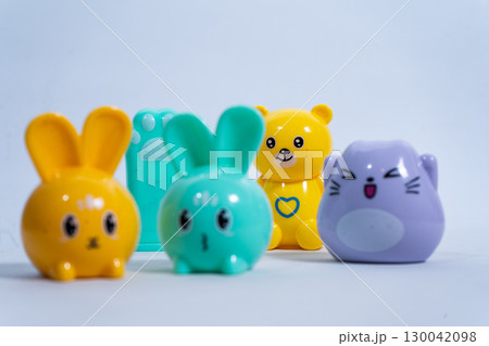 Colorful animal pencil sharpeners posing on white background Colorful animal pencil sharpeners posing on white background 130042098