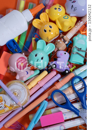 Colorful school supplies forming a back to school background Colorful school supplies forming a back to school background 130042132
