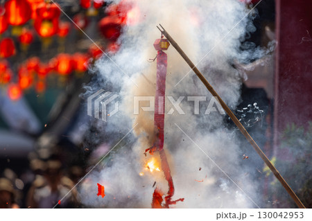 Traditional Chinese firecrackers are exploding with flashes and smoke in Lunar new year. 130042953
