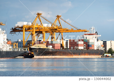 Crane and cargo ship at port in Bangkok City of Thailand. Crane and cargo ship at port in Bangkok City of Thailand. 130044002