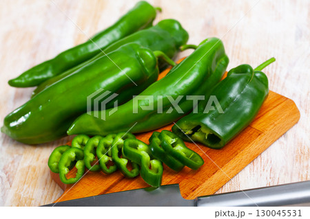 Whole and sliced green peppers Whole and sliced green peppers 130045531