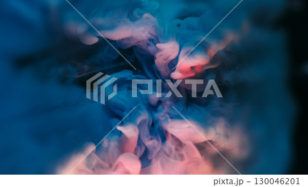 Fluid mix. Swirling mist. Defocused pink blue color paint water wave texture floating on abstract dark black light art background. Fluid mix. Swirling mist. Defocused pink blue color paint water wave texture floating on abstract dark black light art background. 130046201