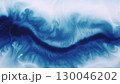 Flowing ink. Spill fluid. Defocused blue white color splash pigment splatter texture spreading on abstract creative art background. 130046202