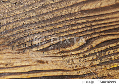 Closeup view of the intricate grain pattern of rustic hardwood surface. Wood texture background 130046999