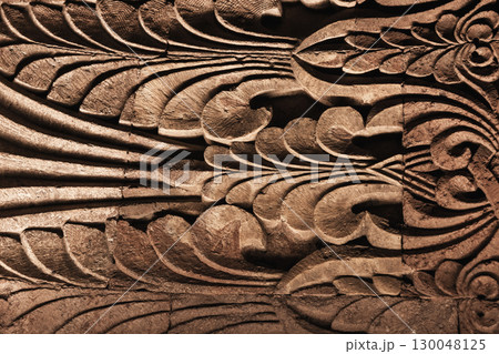 An artistic intricate stone carvings, featuring abstract floral patterns 130048125
