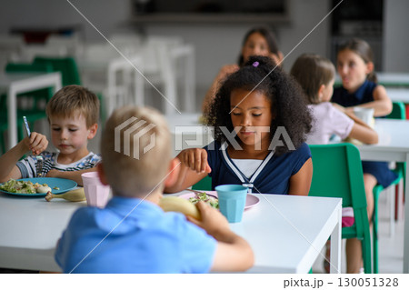 Kids in school eating in canteen, having healthy lunch. Kids in school eating in canteen, having healthy lunch. 130051328