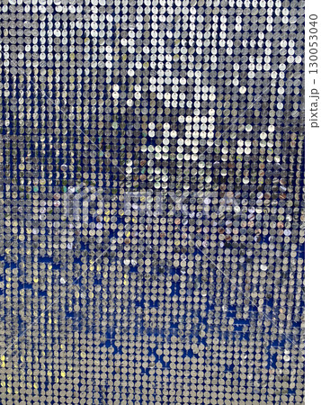 Sequined surface with metallic shimmer texture for abstract background or festive celebration design 130053040