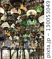 Colorful mosaic lanterns hanging in market with intricate patterns, creating vibrant background 130053049