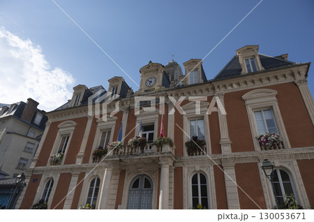 Cauteret's town hall building showcases stunning architecture under a clear blue sky with charming 130053671