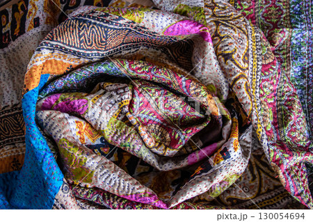 Multi-color handmade texture fabric. Beautiful textile cotton scarf. Cloth background. 130054694