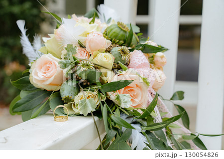 Elegant Wedding Bouquet with Gold Rings  130054826