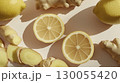Lemon slices and fresh ginger roots, top view pattern, white background, copy space 130055420