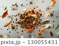 Macro shot of flying spices on black background with copy space, package design element 130055431