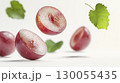 Fresh grape slices and green leaves floating in the air isolated on white background 130055435