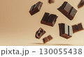 Falling broken chocolate bar pieces, background with copy space 130055438