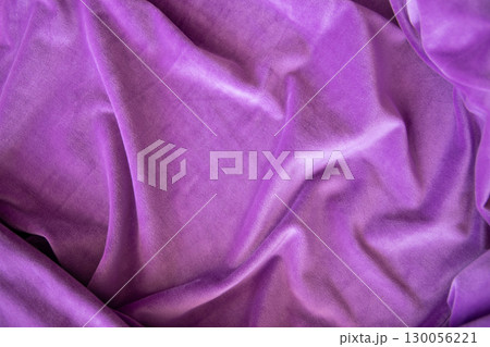 Lilac knitted texture fabric. Purple textile cloth background. Soft material for fashion clothes. Lilac knitted texture fabric. Purple textile cloth background. Soft material for fashion clothes. 130056221