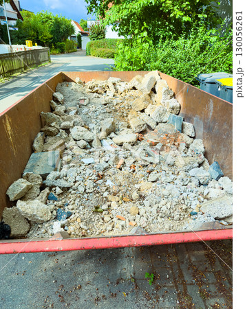 Construction debris in residential dumpsters can significantly impact neighborhoods and ecosystems. Materials like asphalt and concrete from renovations can harm the landscape and environment 130056261