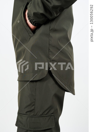 Discover our stylish and modern outdoor apparel collection that showcases a sleek green jacket paired perfectly with versatile cargo pants, designed for both fashion and functionality 130056292