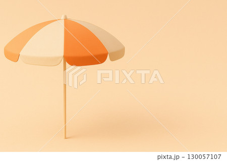 Orange beach umbrella with smooth fabric and wide brim on minimal background creating calm and warm atmosphere 130057107