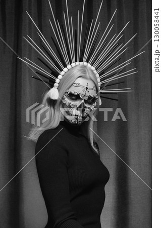 Halloween Make-Up Style, Fancy Dress and Diadem. Blond Model Wear Sugar Skull Makeup with Crown. Santa Muerte concept Halloween Make-Up Style, Fancy Dress and Diadem. Blond Model Wear Sugar Skull Makeup with Crown. Santa Muerte concept 130058441