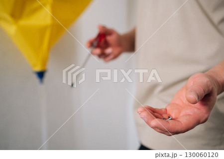 Close-up view of technician hands holding screws and screwdriver while disassembling air conditioning unit, focusing on repair and maintenance tasks for optimal performance. Close-up view of technician hands holding screws and screwdriver while disassembling air conditioning unit, focusing on repair and maintenance tasks for optimal performance. 130060120