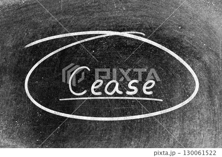 White chalk hand writing in word cease and circle shape on blackboard background 130061522