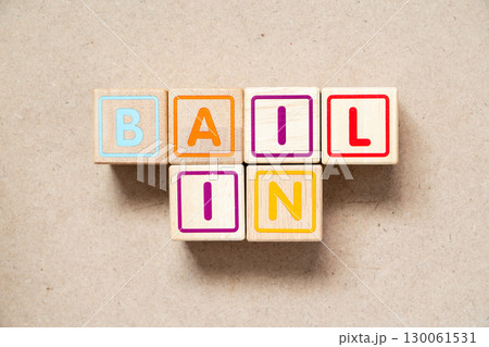 Alphabet letter block in word bail in on wood background Alphabet letter block in word bail in on wood background 130061531