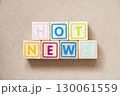 Alphabet letter block in word hot news on wood background 130061559