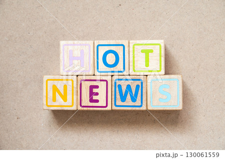 Alphabet letter block in word hot news on wood background Alphabet letter block in word hot news on wood background 130061559