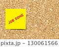 Yellow note paper with word job done on cork board background with copy space 130061566