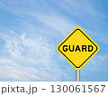 Yellow transportation sign with word guard on blue color sky background 130061567