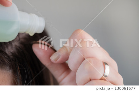Hair extension removal process in beauty salon capsules professionally softened for safe and gentle detachment 130061677