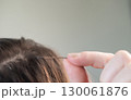 Close up of young woman with combined hair color after capsule extension procedure in beauty salon 130061876