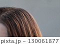 Professional hair extension process with thin capsules hair care treatment in a beauty salon by skilled hairstylist 130061877