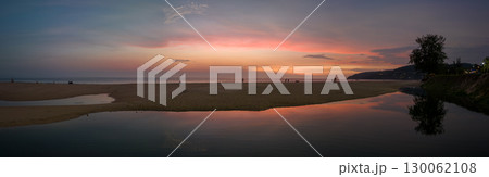 aerial view reflection amazing sky of sunset at Karon beach. 130062108