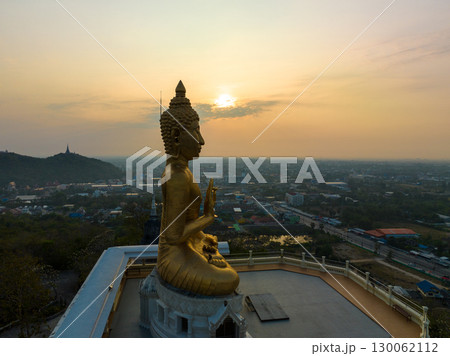 aerial view scenery sky in sunrise above the golden big buddha. aerial view scenery sky in sunrise above the golden big buddha. 130062112