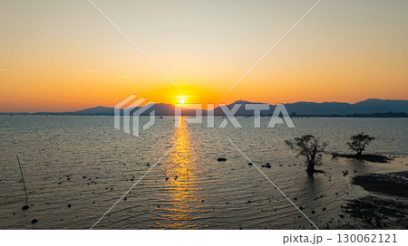 Aerial view of golden Sunset above mangrove trees 130062121