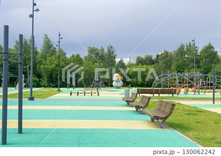 Outdoor park with benches and walkways in the city park. Outdoor park with benches and walkways in the city park. 130062242