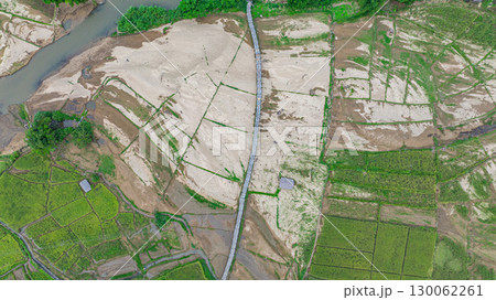 Aerial view of Su Tong Pae bamboo bridge connecting temple to village Aerial view of Su Tong Pae bamboo bridge connecting temple to village 130062261