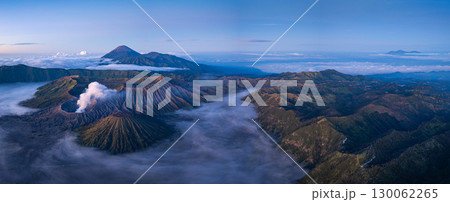 Aerial View of Dramatic landscapes and mist surround Mount Bromo. Aerial View of Dramatic landscapes and mist surround Mount Bromo. 130062265